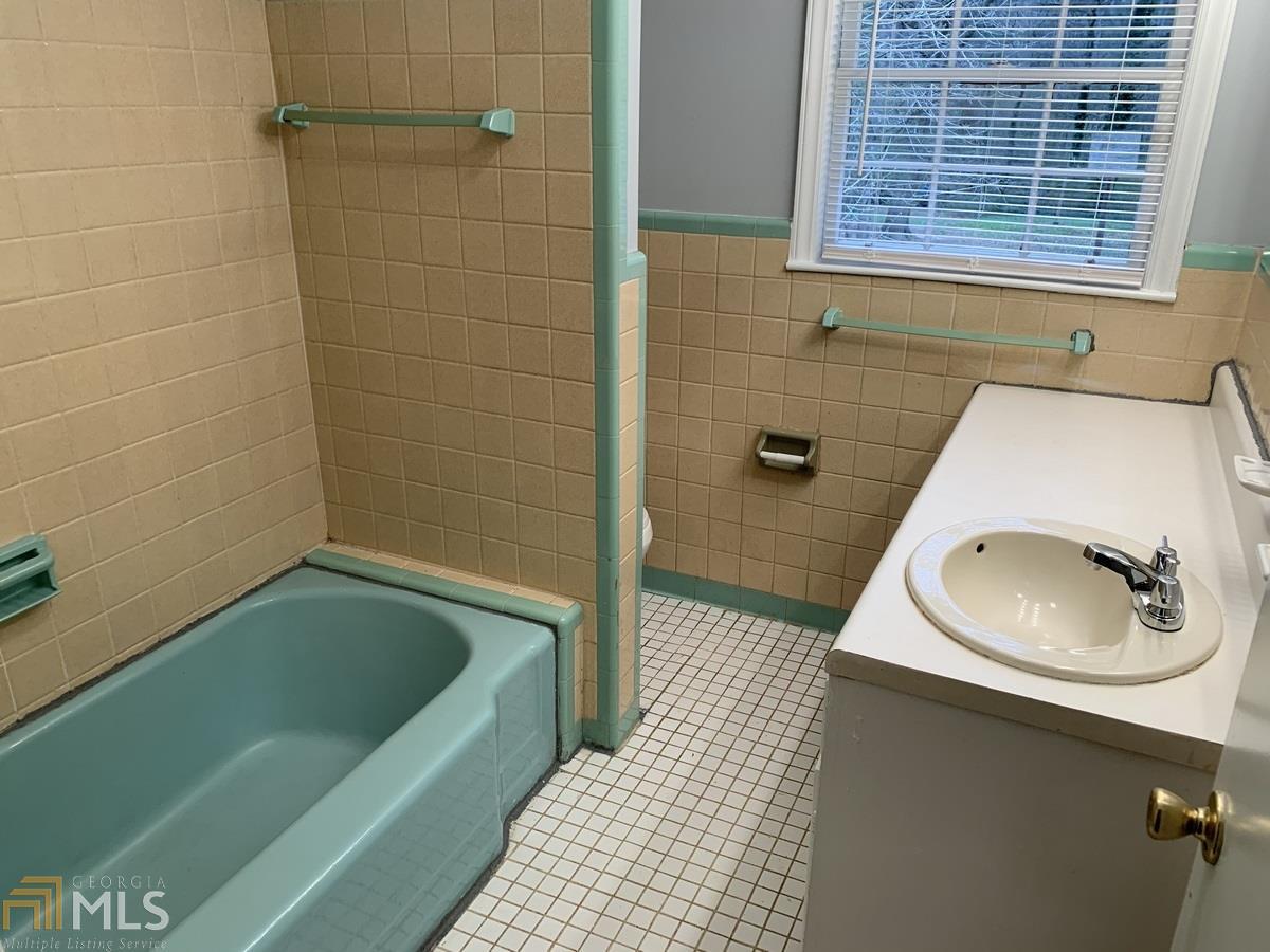 2386 Miriam Lane Decatur, GA 30032 - Photo 12 of 20 a bathroom with a sink a toilet and shower