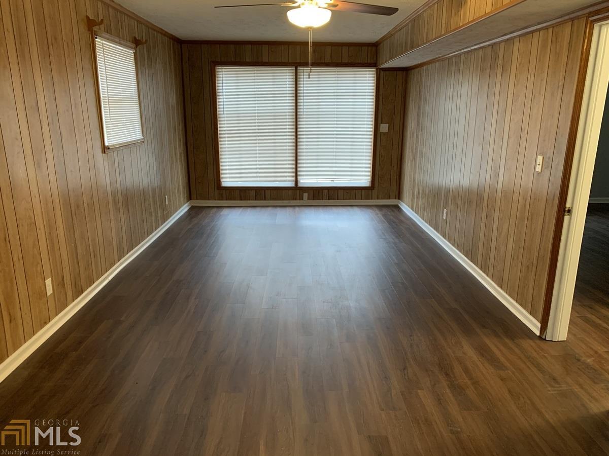 2386 Miriam Lane Decatur, GA 30032 - Photo 14 of 20 an empty room with wooden floor and windows