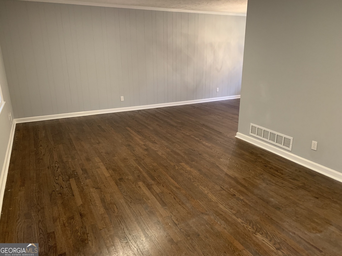 2386 Miriam Lane Decatur, GA 30032 - Photo 3 of 20 a view of an empty room with wooden floor