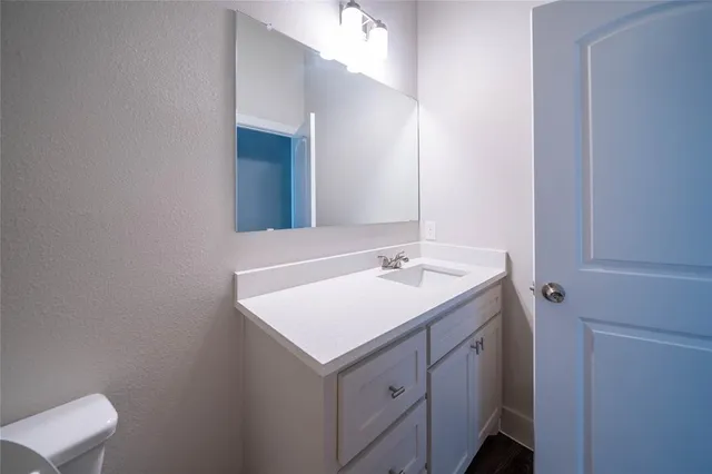 a bathroom with a sink and mirror