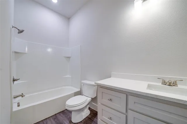 a bathroom with a sink a toilet and a bathtub