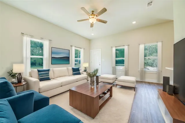 a living room with furniture and a large window