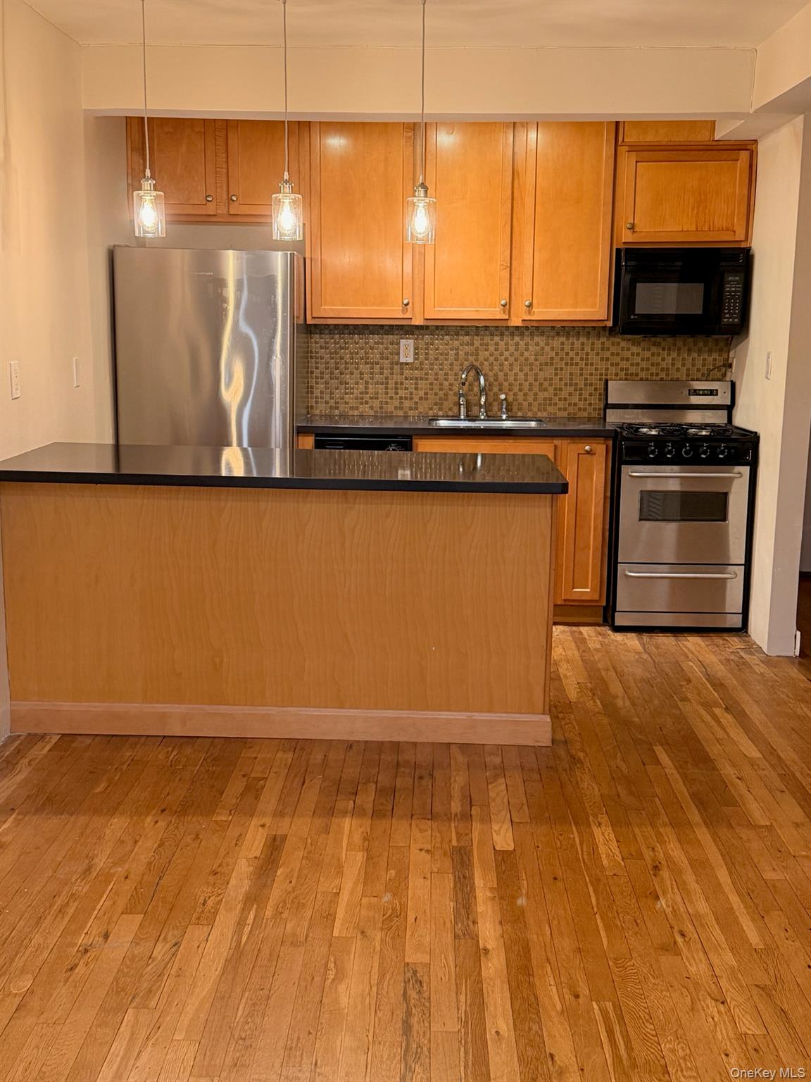 a view of a living room with a flat screen tv
