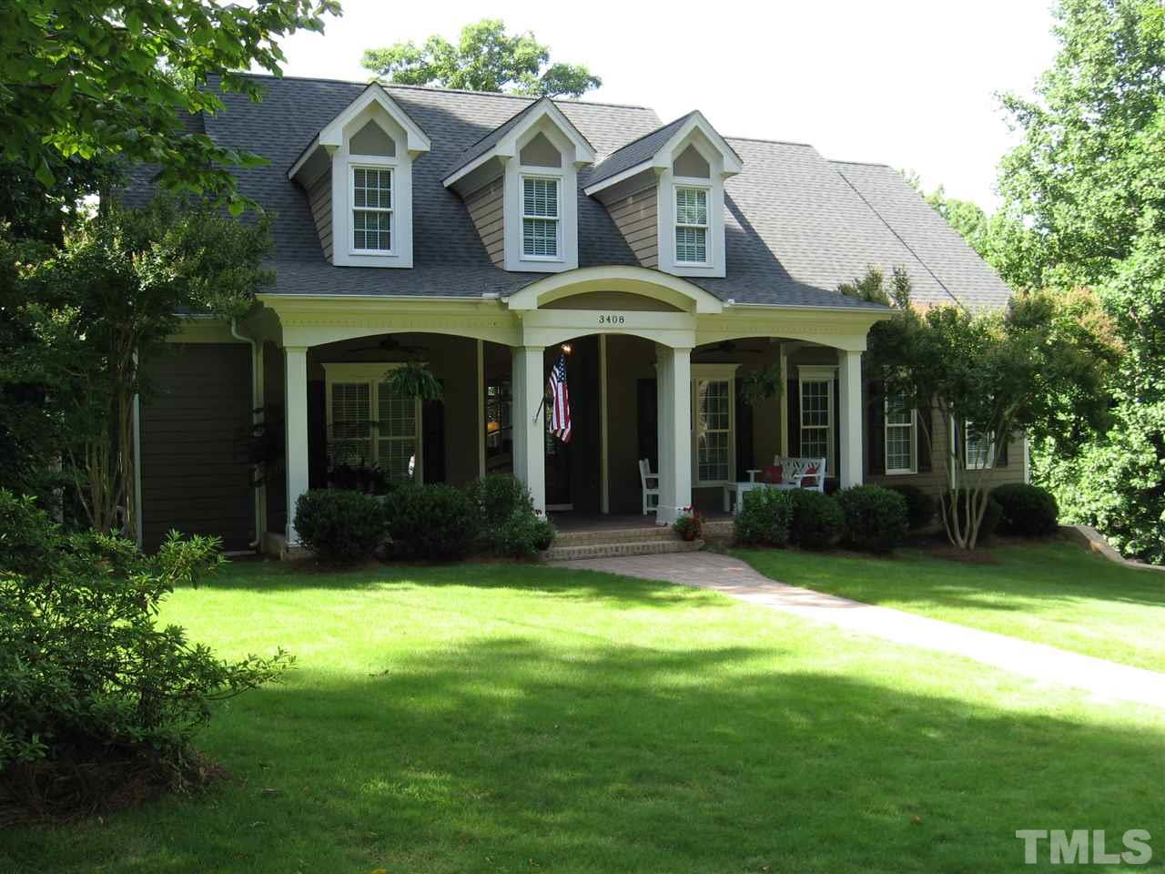 3408 Ocotea Street Raleigh, NC 27607 - Photo 1 of 25 a view of a white house with a big yard and potted plants and trees