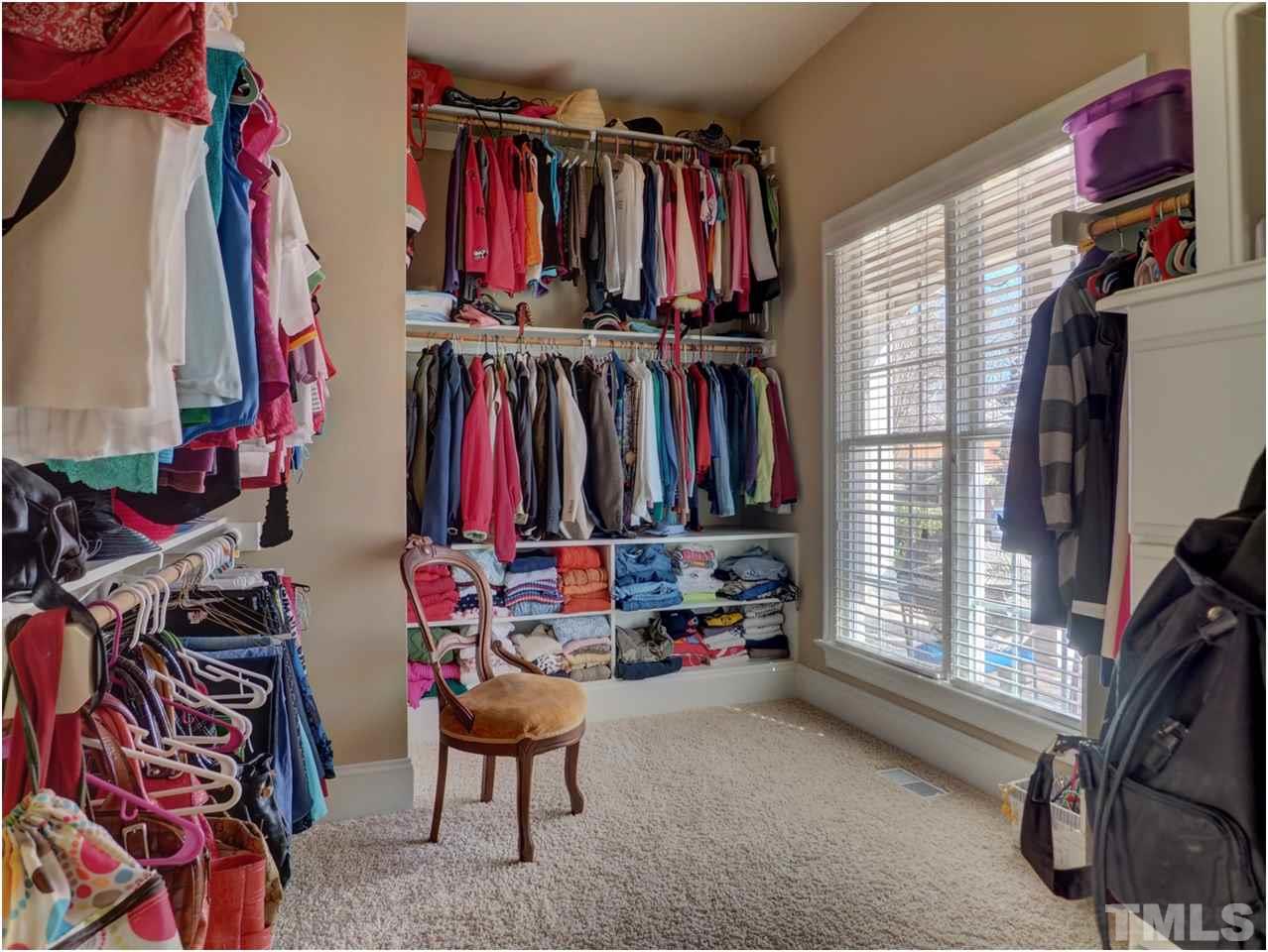 3408 Ocotea Street Raleigh, NC 27607 - Photo 14 of 25 a view of walk in closet with clothes