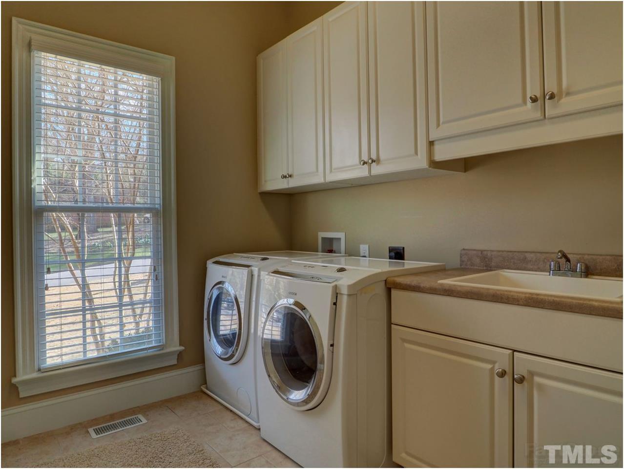 3408 Ocotea Street Raleigh, NC 27607 - Photo 16 of 25 a utility room with dryer and washer