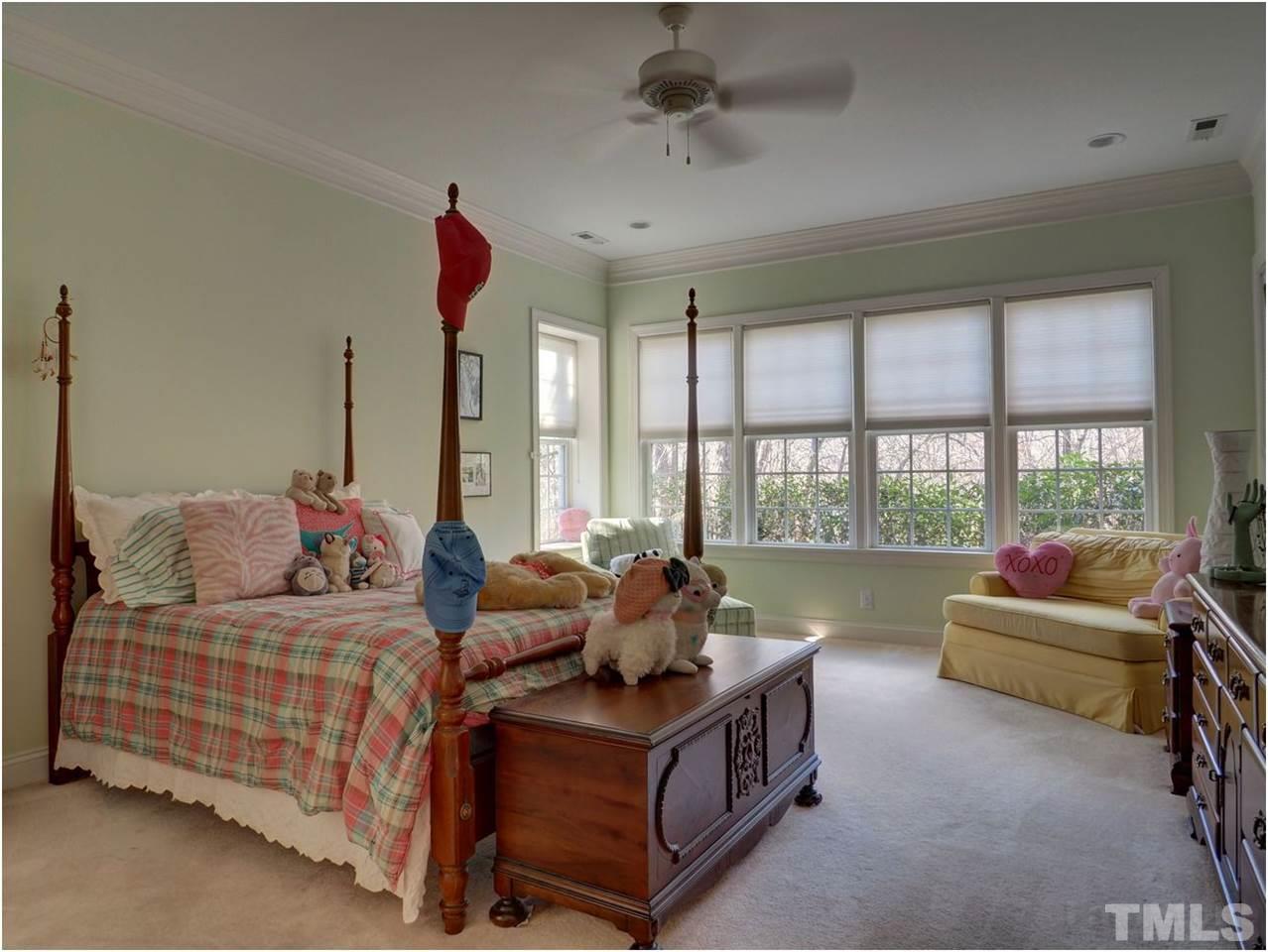 3408 Ocotea Street Raleigh, NC 27607 - Photo 22 of 25 a living room with furniture and a floor to ceiling window