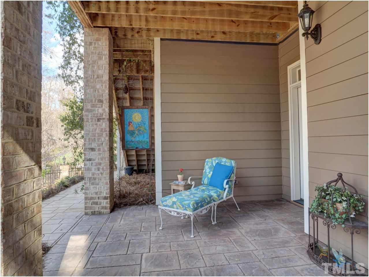 3408 Ocotea Street Raleigh, NC 27607 - Photo 24 of 25 a view of a patio with chair and table