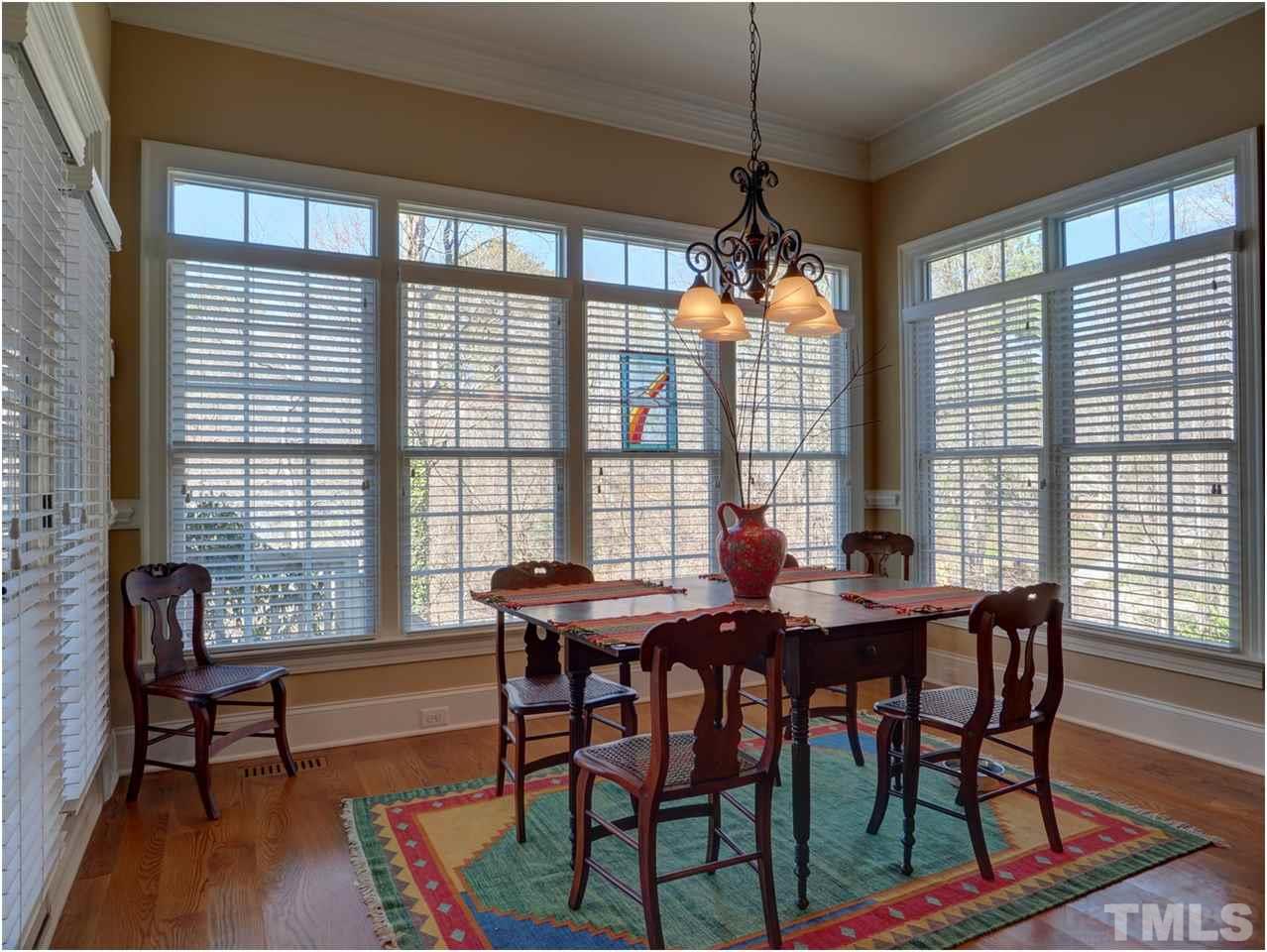 3408 Ocotea Street Raleigh, NC 27607 - Photo 6 of 25 a view of a dining room with furniture and window