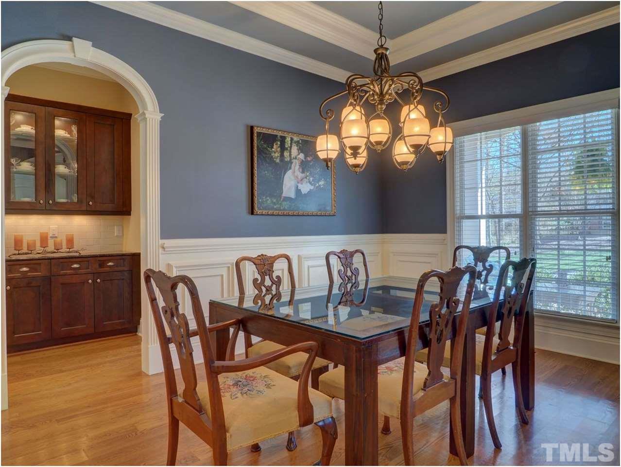 3408 Ocotea Street Raleigh, NC 27607 - Photo 8 of 25 a view of a dining room with furniture window and wooden floor