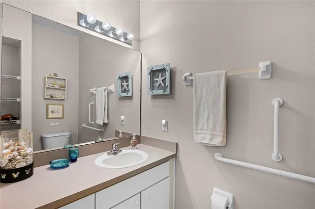 a bedroom with furniture and a chandelier