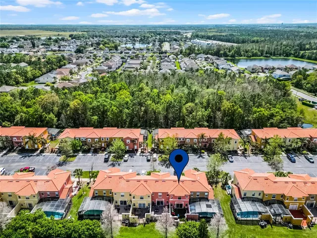 an aerial view of residential houses and outdoor space