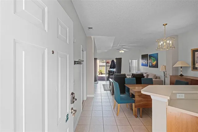 a kitchen with refrigerator and sink