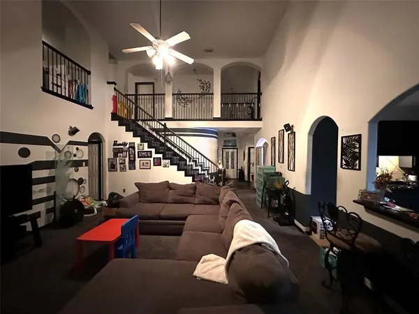 a living room with furniture fireplace and flat screen tv