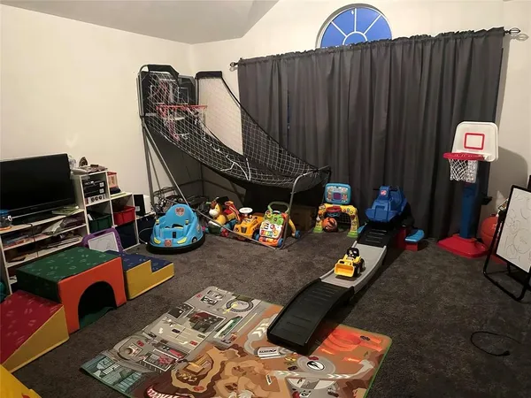 a bedroom with furniture and a wooden floor