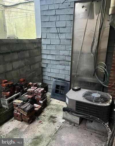 1110 South 7th Street Philadelphia, PA 19147 - Photo 15 of 16 a room with fireplace and a wooden floor