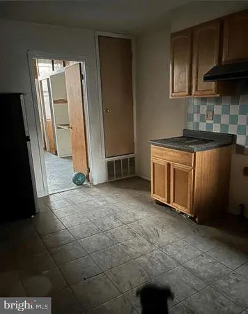 a view of an empty room with a fireplace