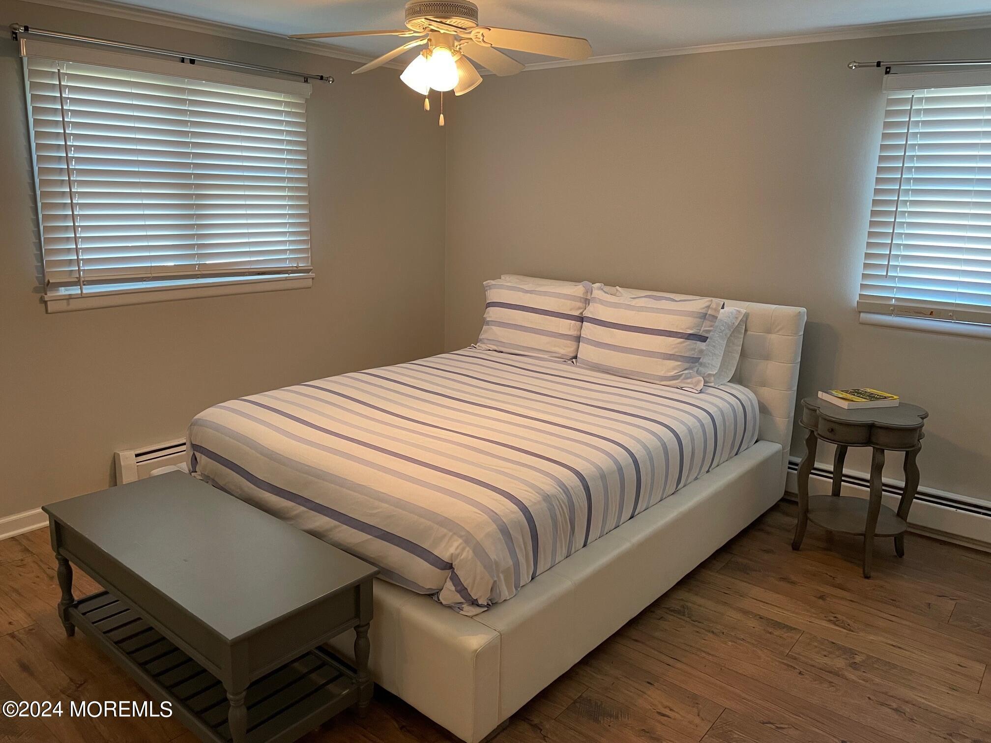 77 Jib Lane Brick, NJ 08723 - Photo 11 of 23 a bedroom with a bed and a table