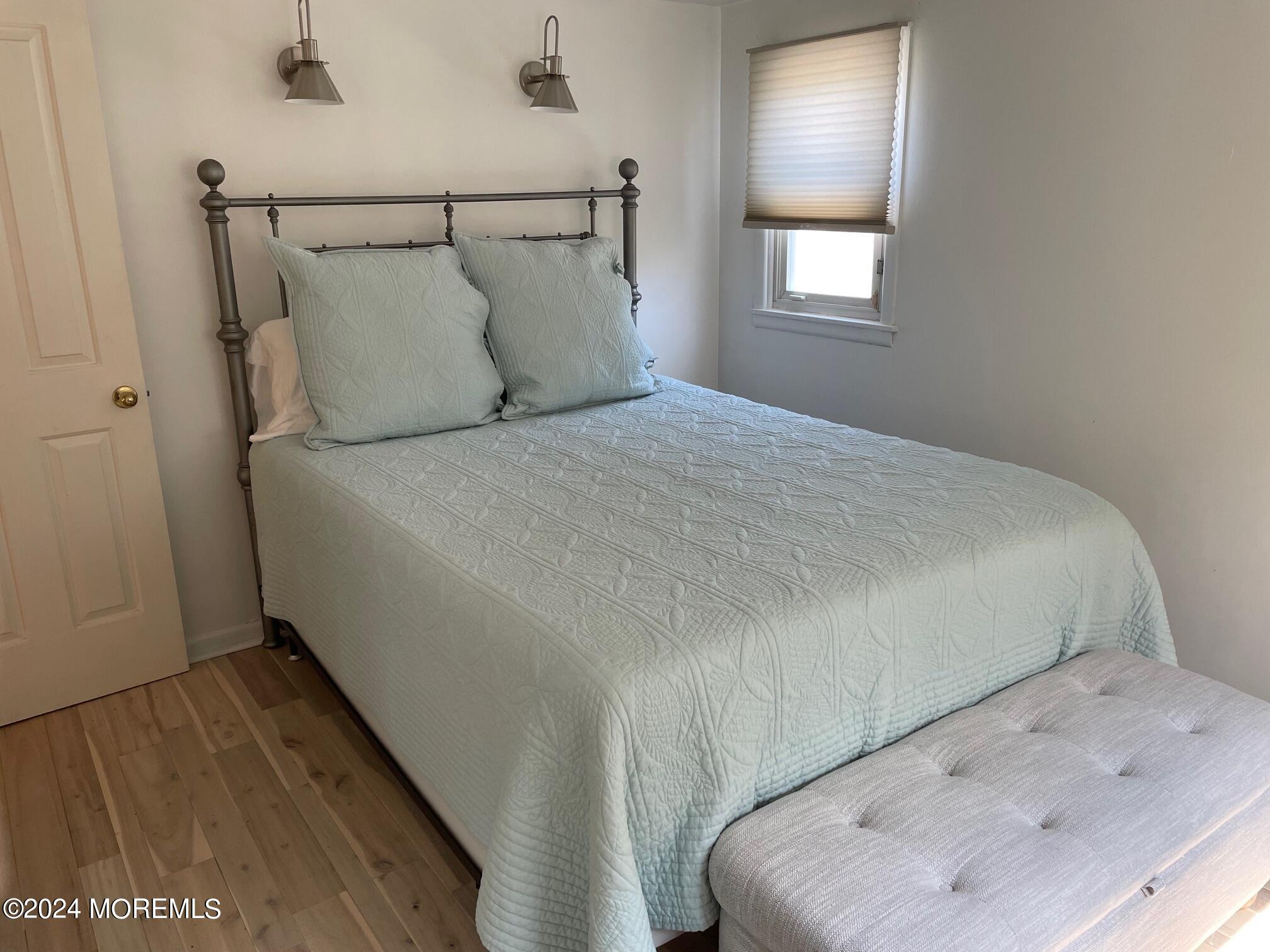 77 Jib Lane Brick, NJ 08723 - Photo 12 of 23 a bed sitting in a bedroom next to a window