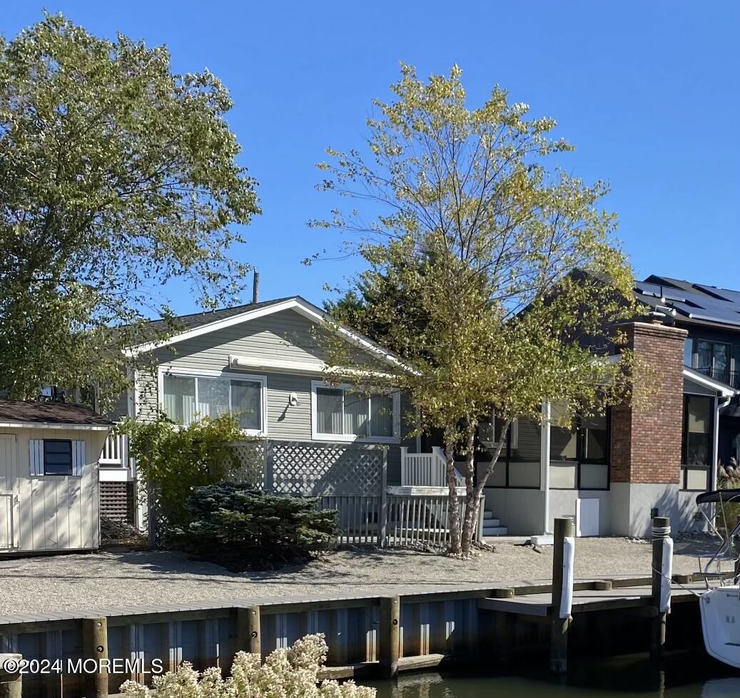 77 Jib Lane Brick, NJ 08723 - Photo 16 of 23 a front view of a house with porch