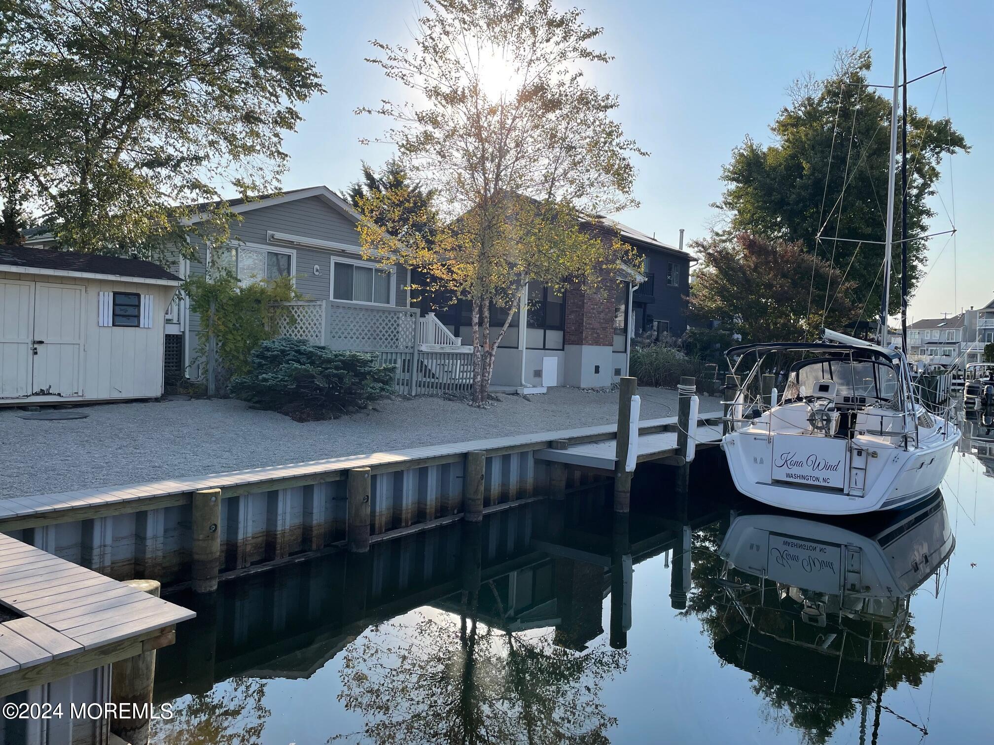 77 Jib Lane Brick, NJ 08723 - Photo 17 of 23 a view of house with roof deck and seating space
