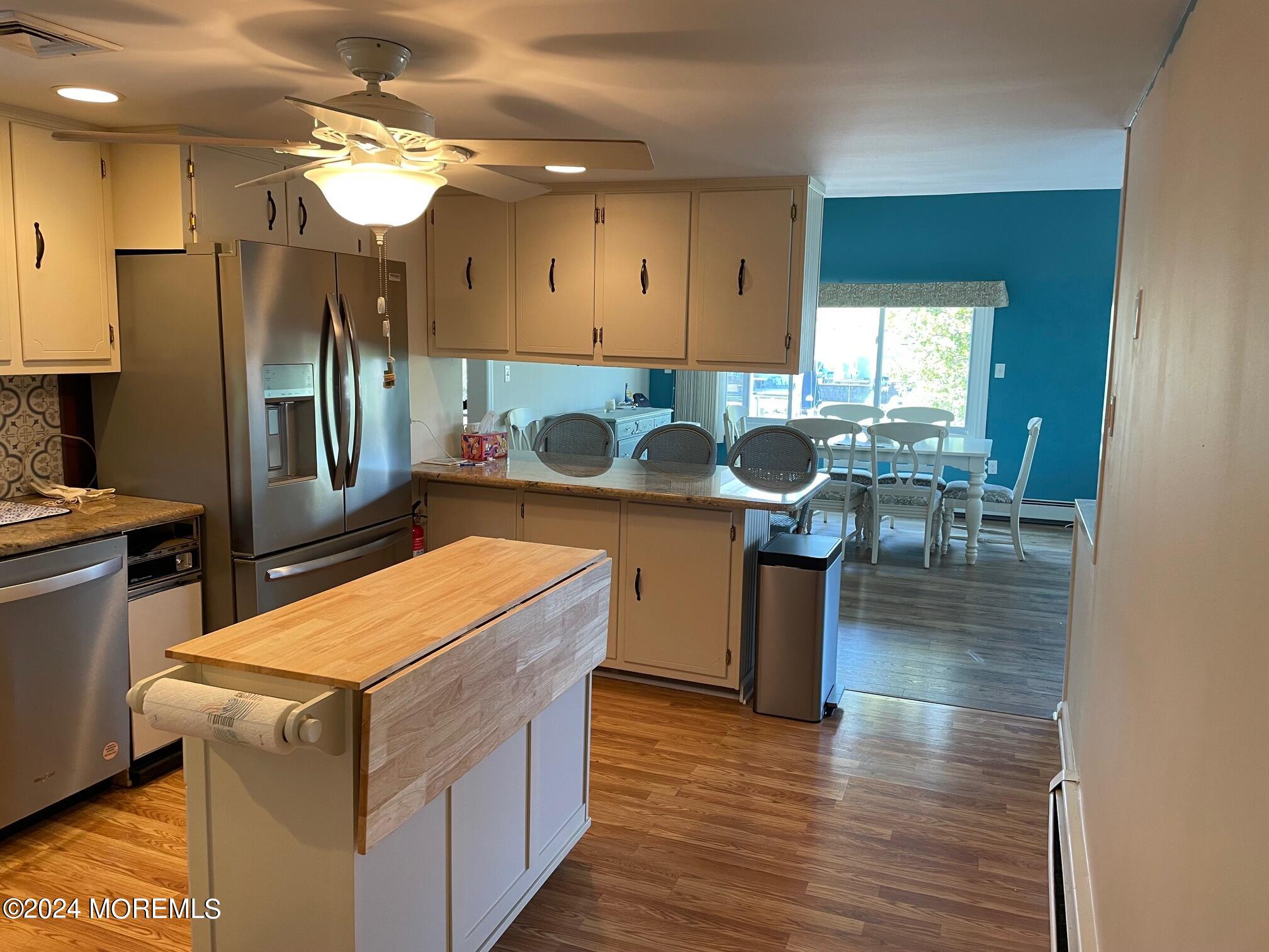 77 Jib Lane Brick, NJ 08723 - Photo 5 of 23 a kitchen with stainless steel appliances granite countertop a stove and a refrigerator