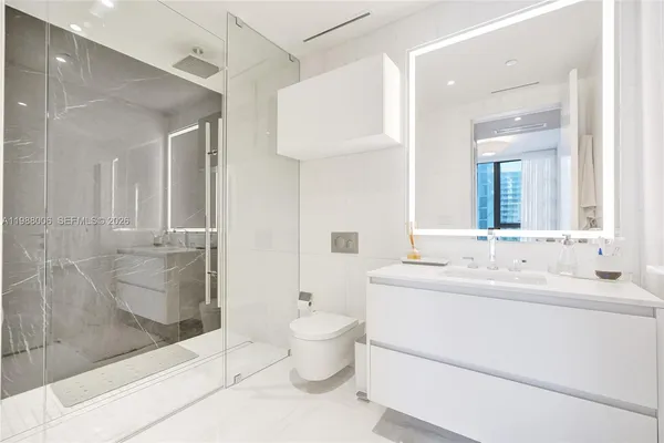 a bathroom with a bathtub and a shower