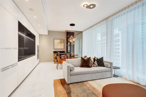a view of a livingroom with furniture and a flat screen tv