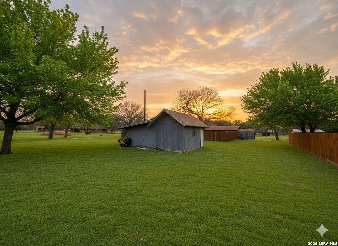 106 Adkins Road Refugio, TX 78377 - Photo 4 of 11 a view of a big yard with a house