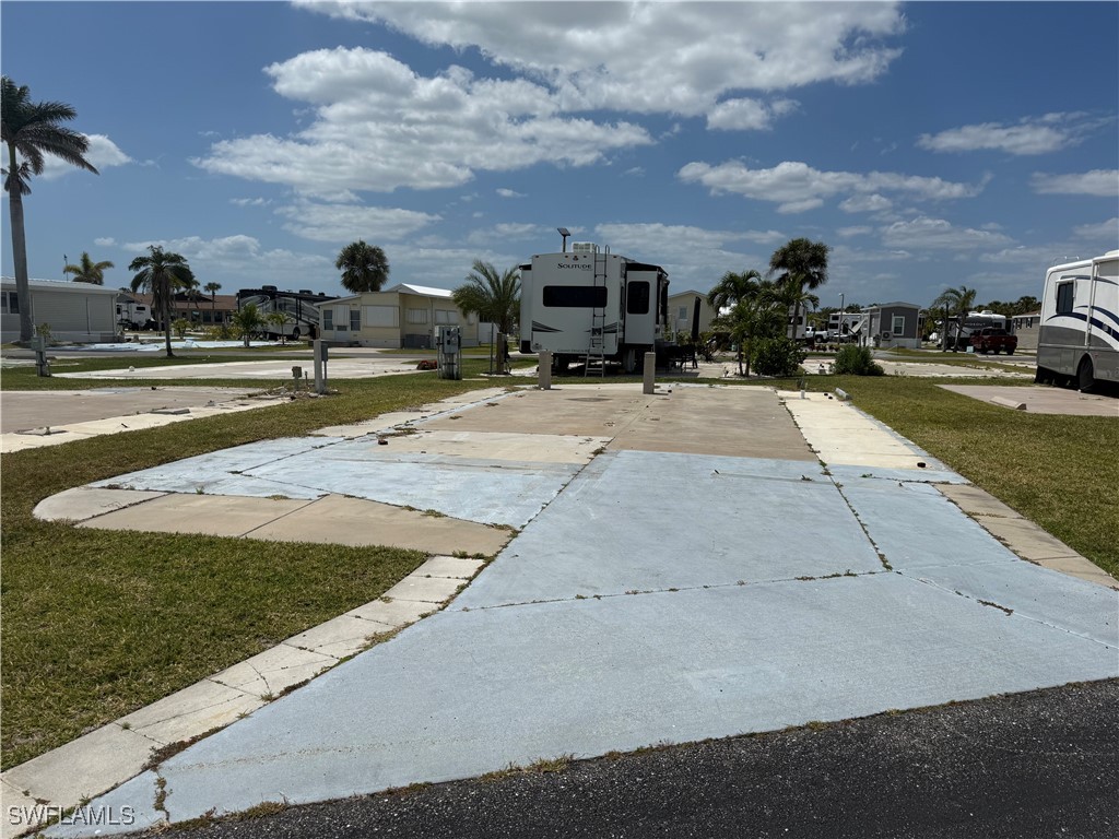 a view of multiple houses with a yard