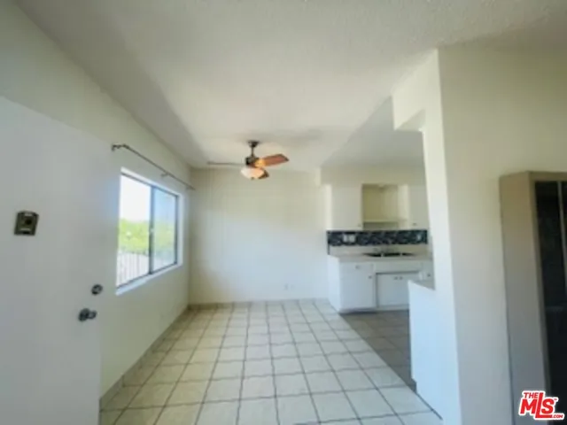 a view of a kitchen with a sink and a stove top oven