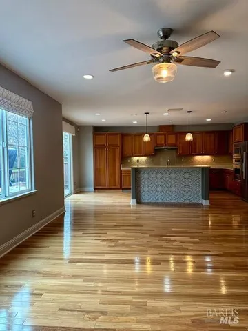 a view of a kitchen with a table and chairs