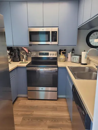 a kitchen with a stove and a microwave