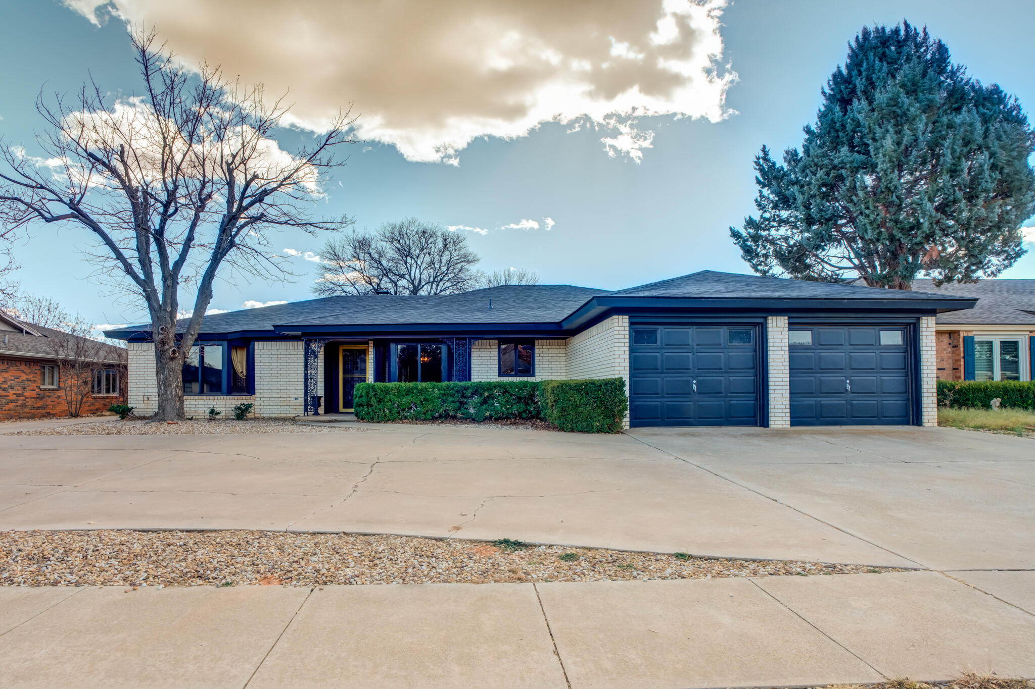 a front view of a house with garden