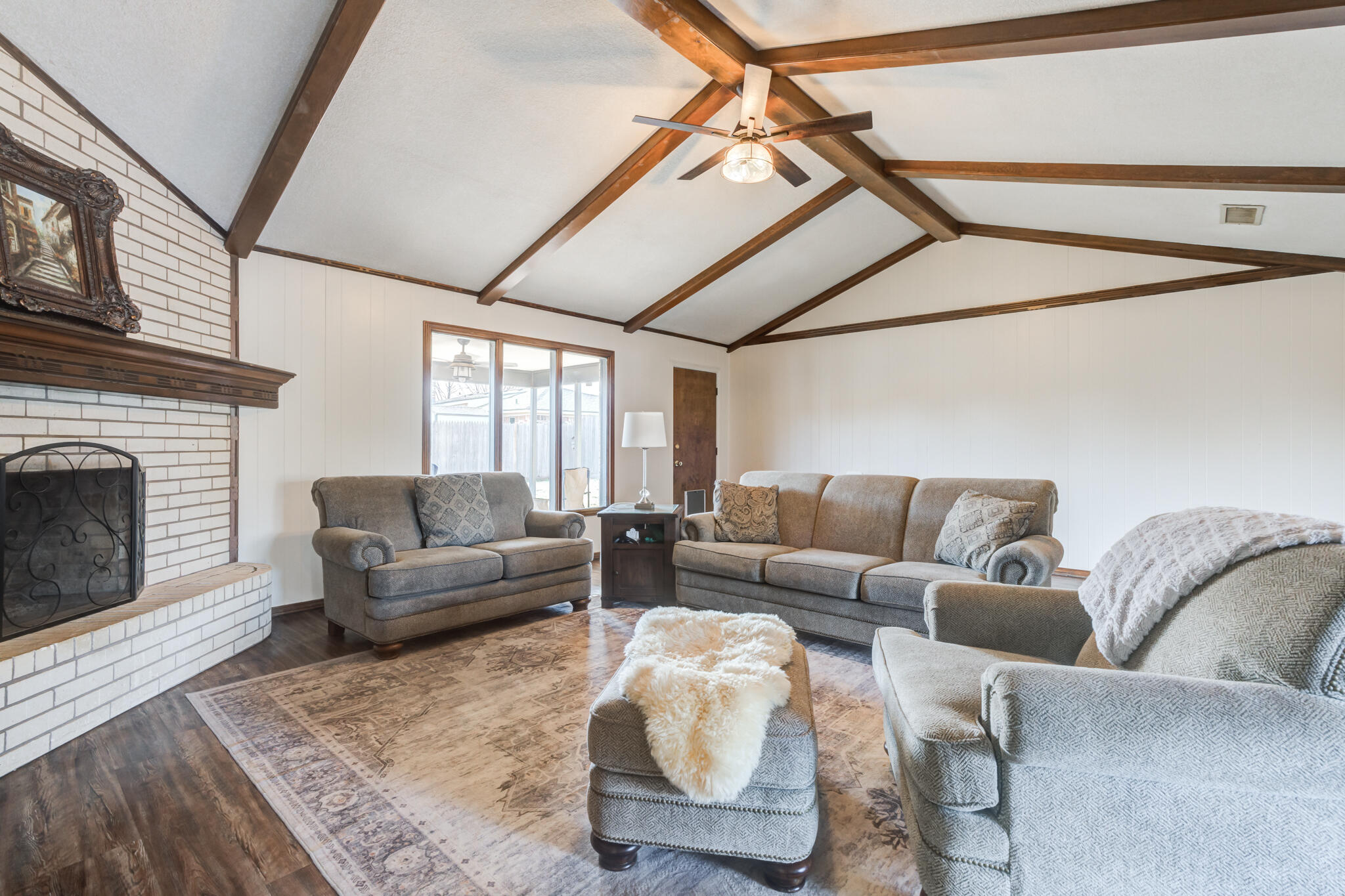 5703 80th Street Lubbock, TX 79424 - Photo 11 of 45 a living room with furniture and a fireplace