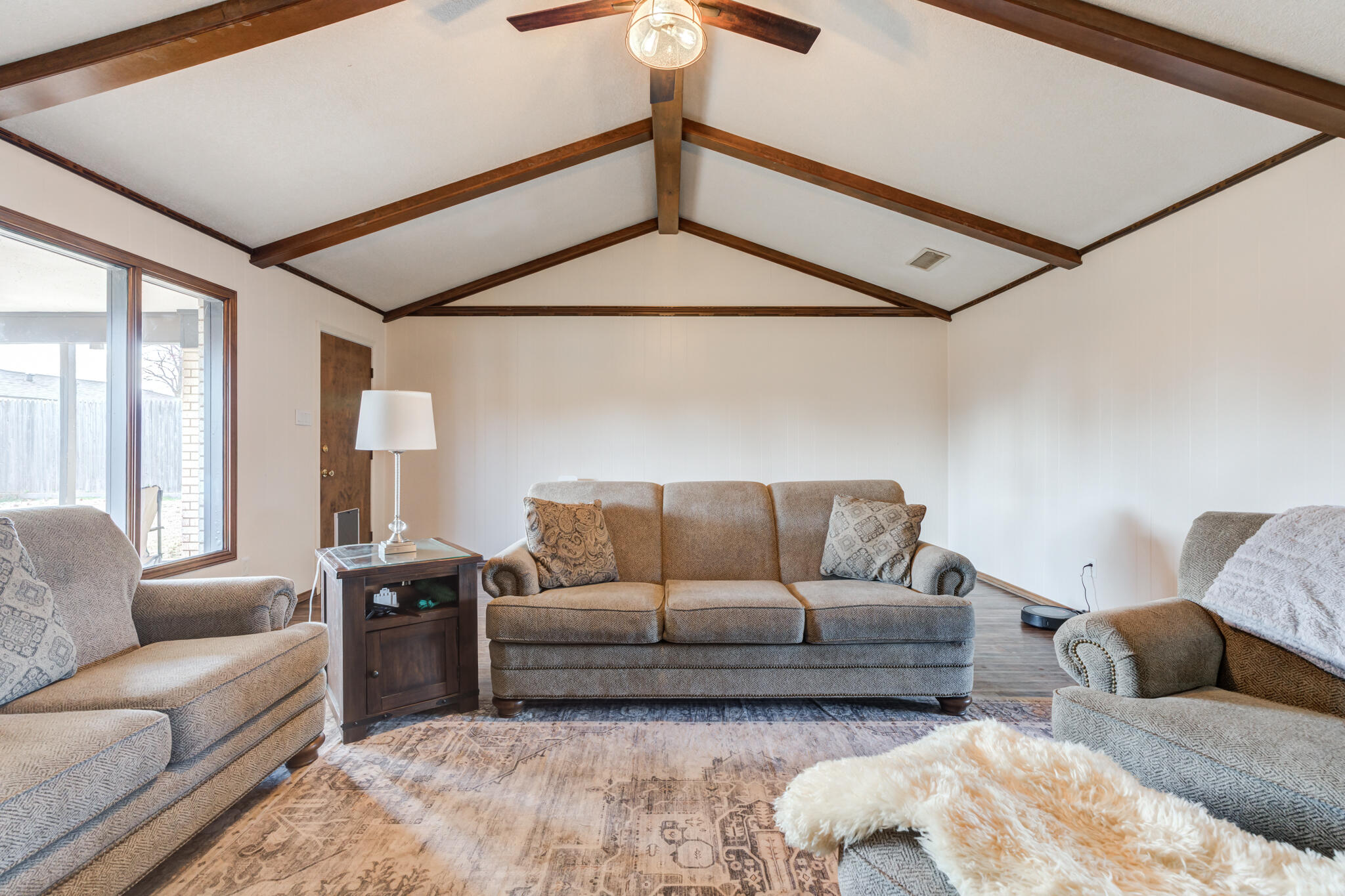 5703 80th Street Lubbock, TX 79424 - Photo 12 of 45 a living room with furniture and a ceiling fan