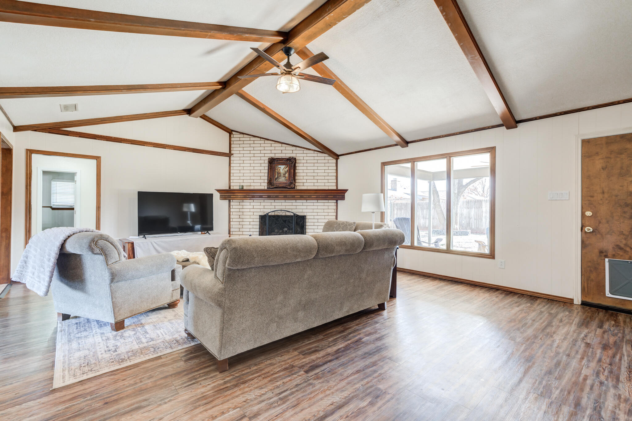 5703 80th Street Lubbock, TX 79424 - Photo 18 of 45 a living room with furniture and a fireplace
