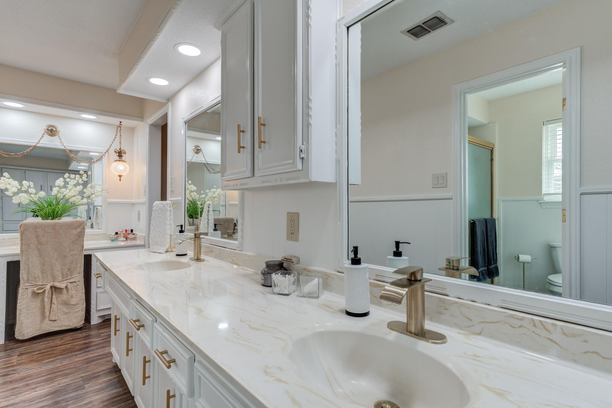 5703 80th Street Lubbock, TX 79424 - Photo 32 of 45 a bathroom with double vanity and a mirror