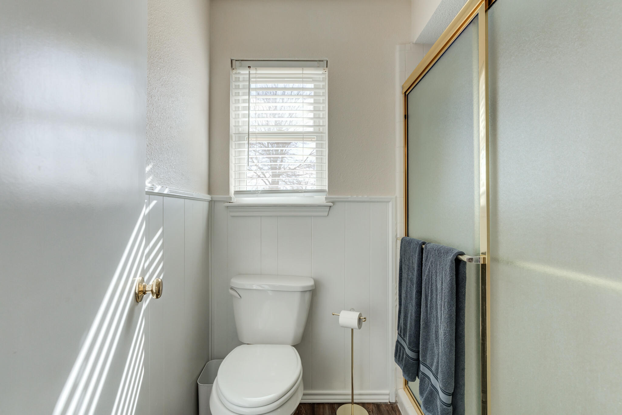 5703 80th Street Lubbock, TX 79424 - Photo 33 of 45 a white toilet sitting next to a window