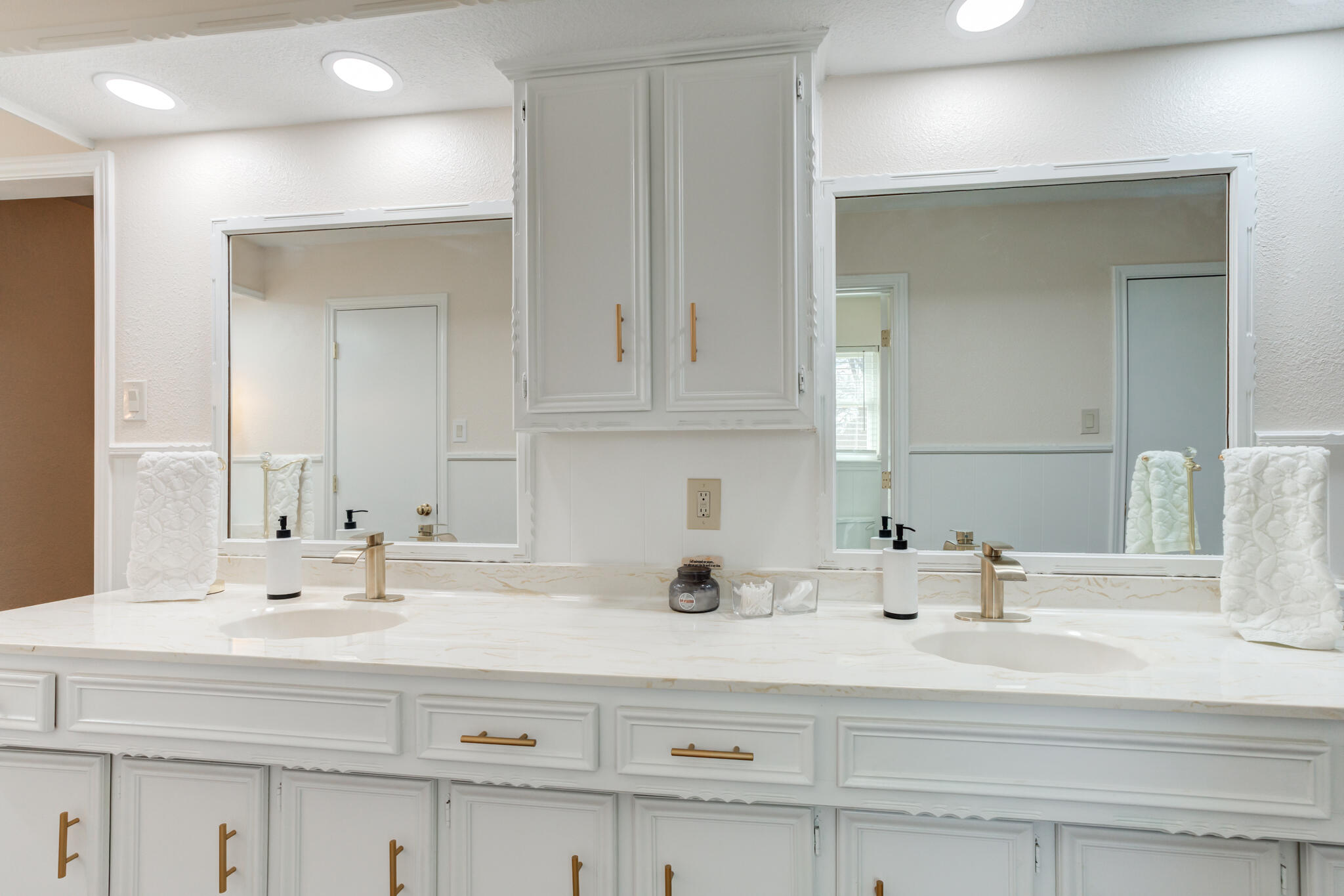 5703 80th Street Lubbock, TX 79424 - Photo 34 of 45 a bathroom with double vanity sink and a mirror