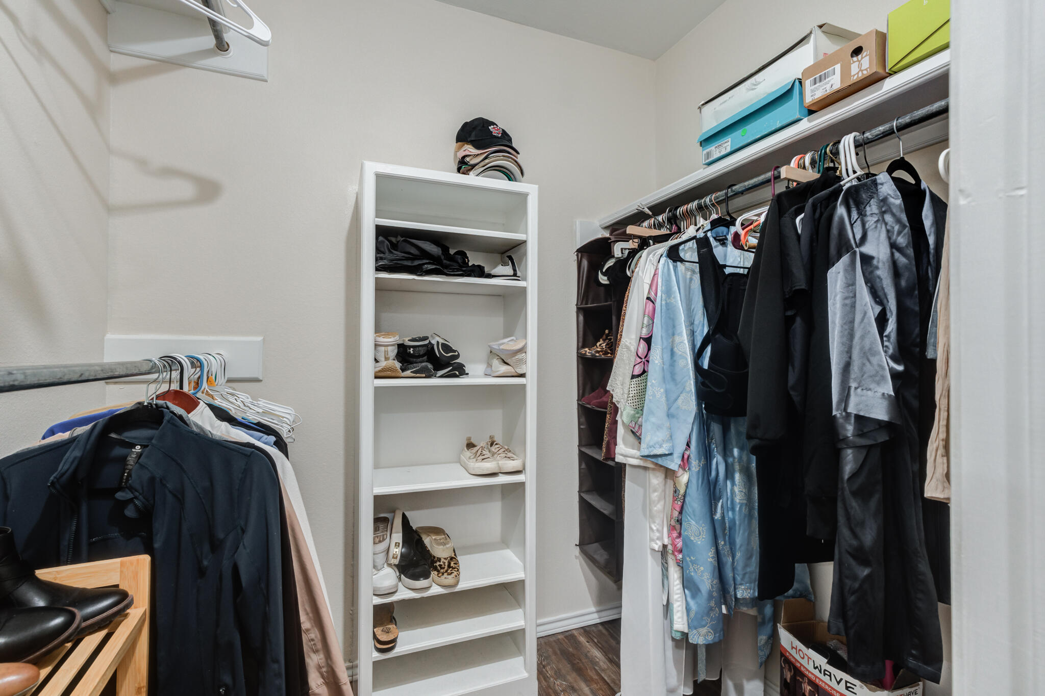 5703 80th Street Lubbock, TX 79424 - Photo 35 of 45 a view of walk in closet with clothes and shoes