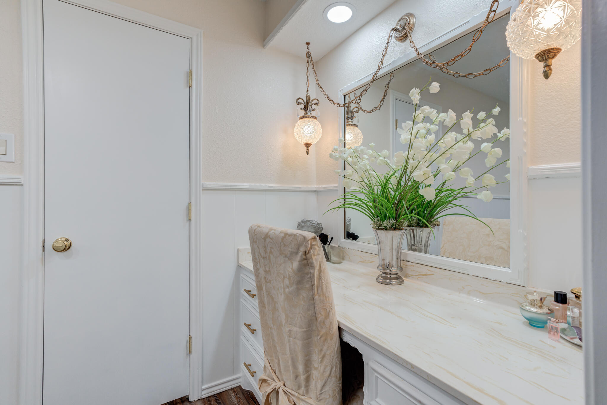 5703 80th Street Lubbock, TX 79424 - Photo 37 of 45 a bathroom with a sink a mirror and a shower