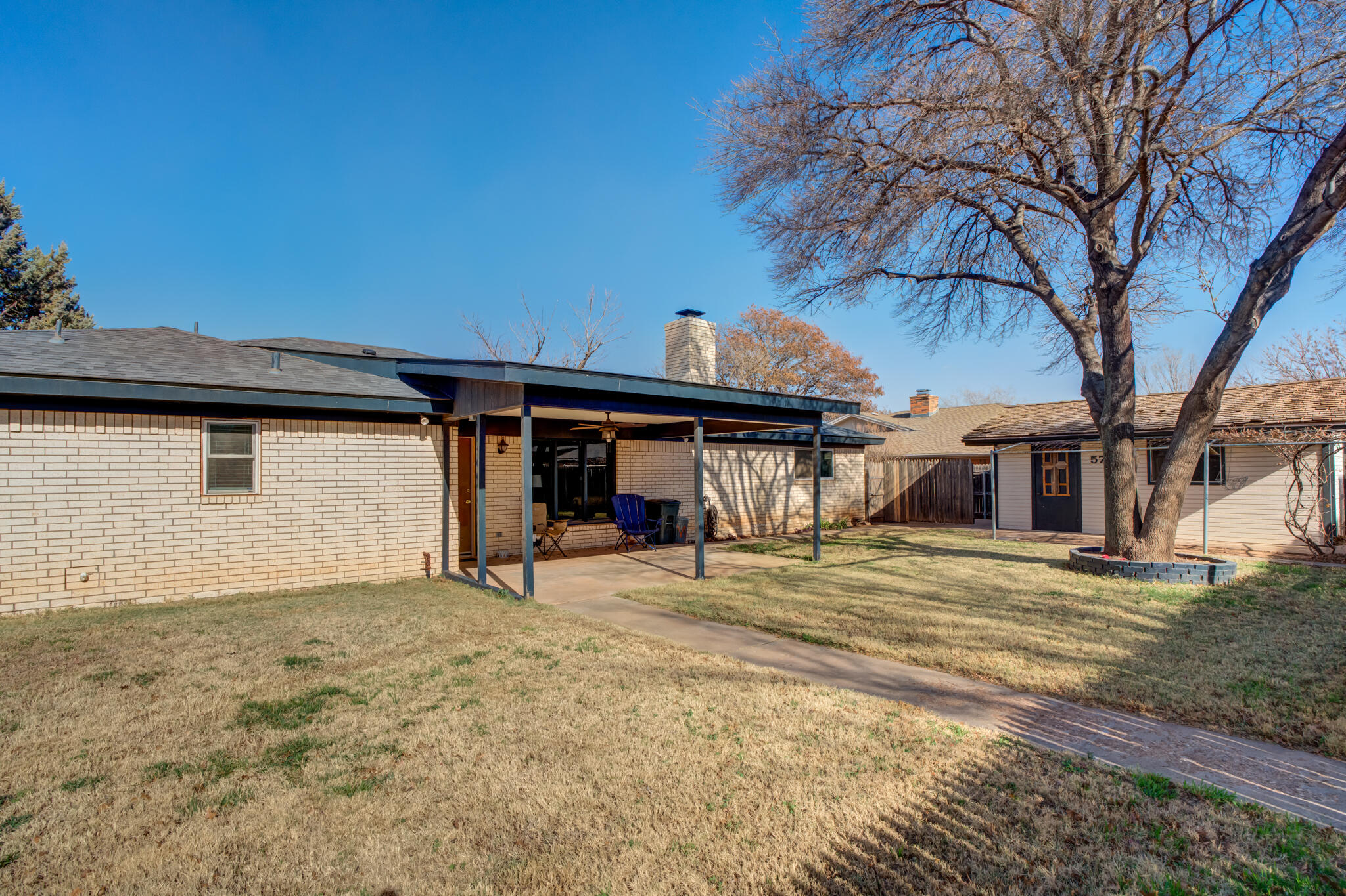 5703 80th Street Lubbock, TX 79424 - Photo 41 of 45 a house with trees in front of it