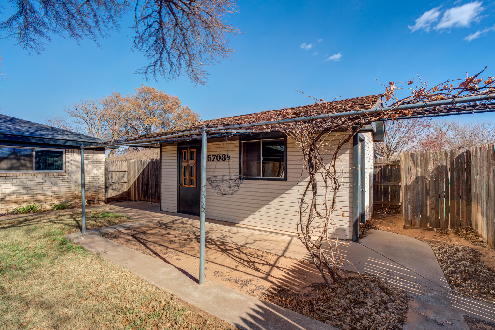 5703 80th Street Lubbock, TX 79424 - Photo 42 of 45 a view of a house with wooden fence