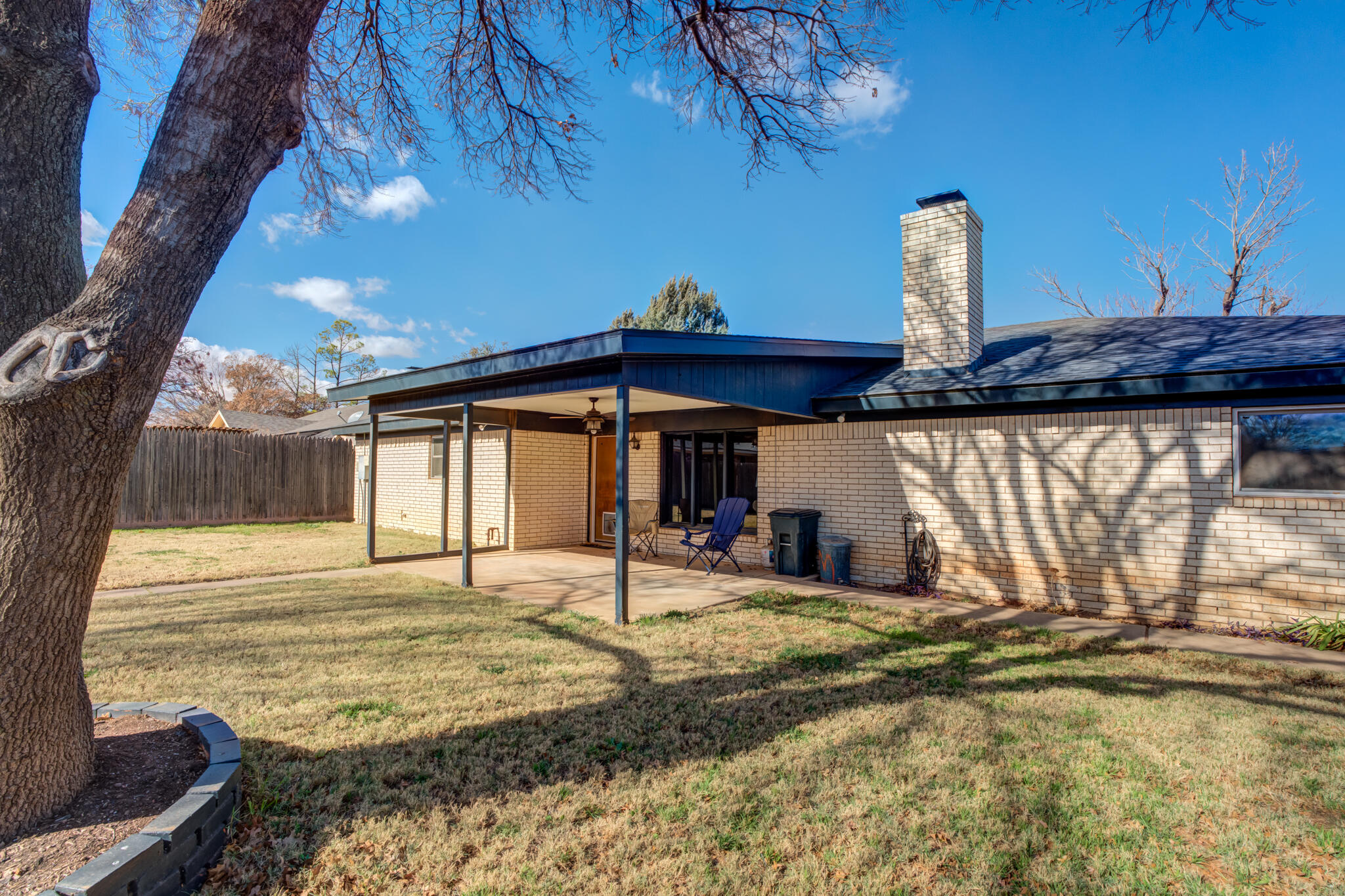 5703 80th Street Lubbock, TX 79424 - Photo 43 of 45 a view of a house with backyard and sitting area