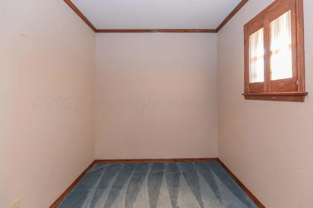 a view of a livingroom with a chandelier fan
