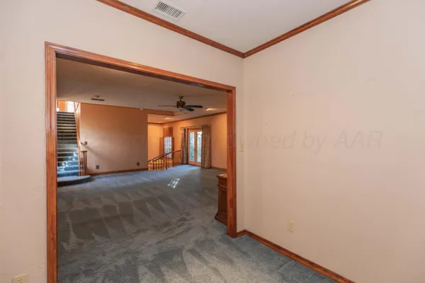 a view of an empty room with a window
