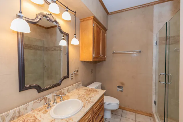 a view of backyard with barbeque grill and outdoor seating