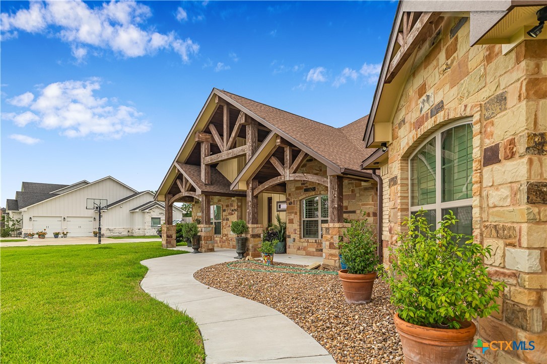 254 Sendera Loop Victoria, TX 77904 - Photo 10 of 48 a front view of a house with garden