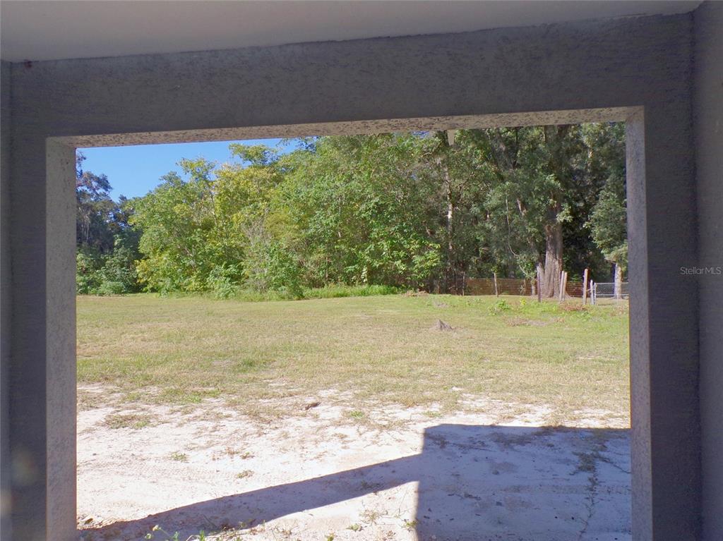 4341 Northwest 154th Street Reddick, FL 32686 - Photo 11 of 11 Nice Backyards - view from covered patio